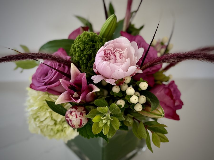 Mother's Day arrangement — warm, abundant seasonal blooms